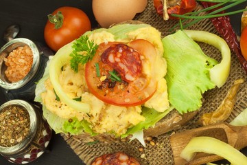 Fresh scrambled eggs on sunflower bread. Healthy food . Domestic food preparation. Eggs for a snack. Diet food. Toasted bread with scrambled eggs.
