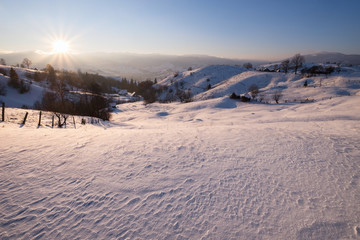 Winter sunset at mountain hills