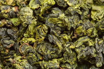Fototapeta na wymiar dried tea leaves closeup as background