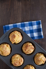 Corn Bread Muffins In Muffin Pan On Country Distressed Wood Tabl