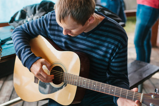 Learning to play the guitar. Music education and extra-curricular lessons.