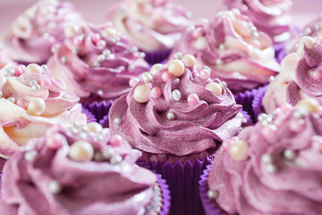 Delicious and sweet cupcakes . They are sequined .