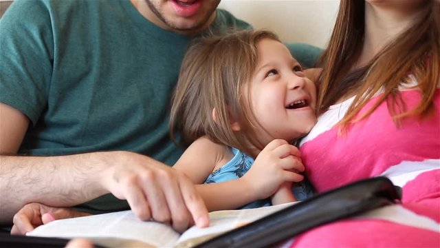 Young family studying the Word of God