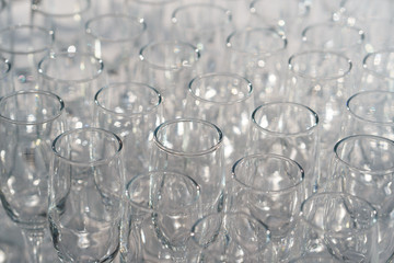 glasses of white wine in a row on the table in pyramid