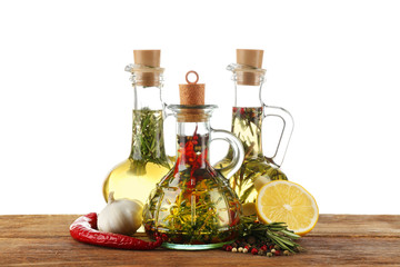 Obraz na płótnie Canvas Olive oil with spices, isolated on white