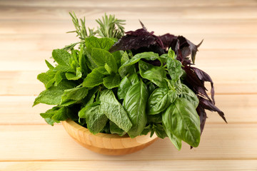 Mix of herbs and spices on wooden table