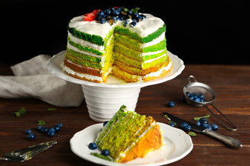 Delicious cake on dark background