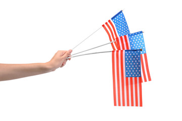 Female hand holding American flags on white background