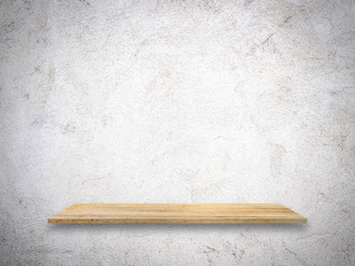 Wooden shelf for display your product on dirty white cement wall background