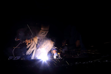 welder worker welding metal construction