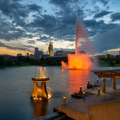 Colorful water fountains in front of downtown at Heartland of America Park in Omaha, Nebraska - obrazy, fototapety, plakaty