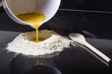 Flour being formed into pasta