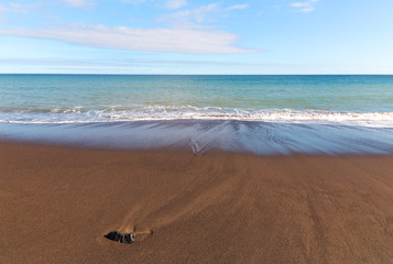 Fogo beach in Ribeira Quente village of Azores, Portugal. The beach is known for volcanic black sand and tepid waters.