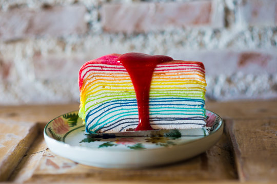 Rainbow crape cake on wooden table