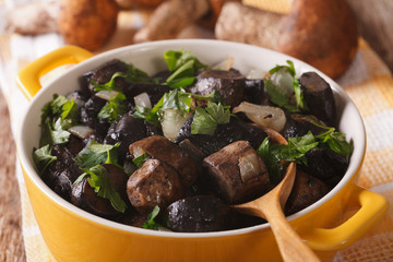 wild mushrooms fried with onions and parsley close-up. horizontal
