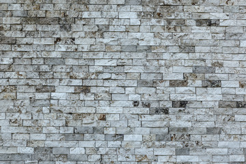Gray brick wall in closeup