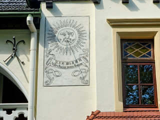 Sundial on the wall on a small street-promenade located in the city center of Rzeszow. Poland.