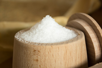 Small cup of salt on the kitchen table