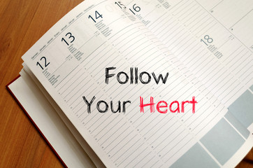 Follow your heart text concept on notebook