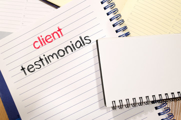 Client testimonials text concept on notebook