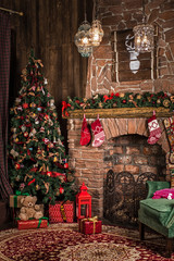 Christmas decorations: a green chair by the fireplace, a tree with toys and gifts