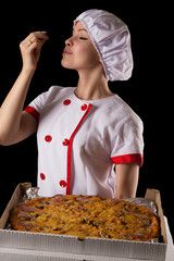 young girl chef enjoying pizza smell