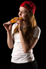 young attractive girl eating pizza