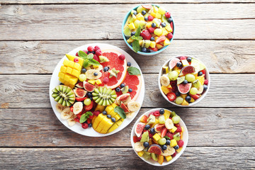 Fresh fruit salad on a grey wooden table