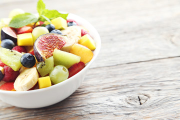 Fresh fruit salad on a grey wooden table