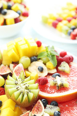 Fresh fruit salad on a white wooden table