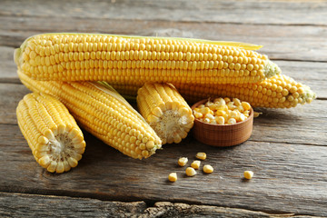 Sweet corns on a grey wooden table