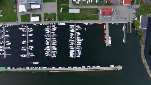 Aerial yachts in marina on lake vertical