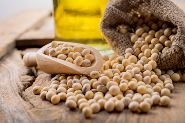 closeup is some soybeans with wooden spoon