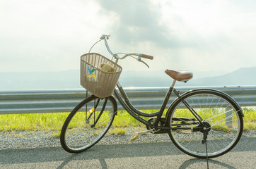 Fototapeta na wymiar bicycle on an asphalt road. travel concept