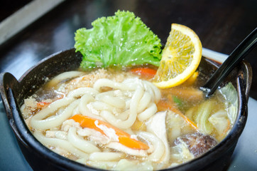 Japanese udong noodles with fresh egg and hot soup