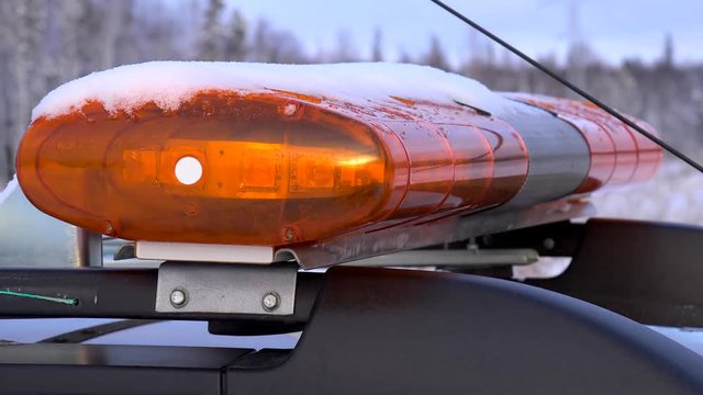 Flashing amber warning lightbar at winter.