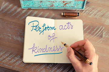Handwritten text Perform Acts of Kindness