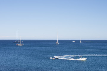 A view from the embankment on the yachts moored at the coast. Antibes - one of the cities of French riviera