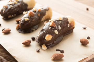 Mini chocolate covered frozen bananas with almonds