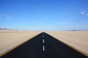 Clean black highway in the desert