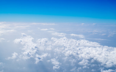 Naklejka na ściany i meble Aerial view of cloud and sky from airplane,Traveling concept
