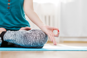 Yoga meditation in light room, lotus position, jnana mudra