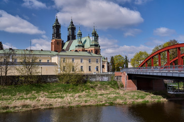 Urban landscape with river Warta and the cathedral towers in Poznan.