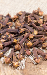 Cloves on a wood board.
