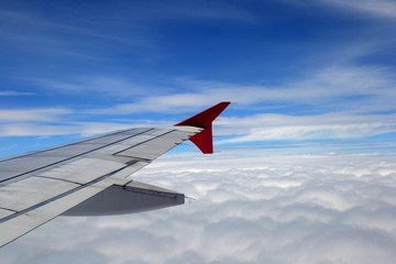 Fototapeta premium window of jet plane with blue sky and city view