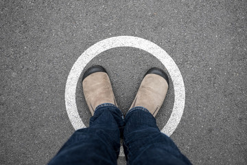 Man standing in white circle on the floor