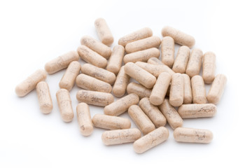 Ginkgo biloba capsule on the white background.