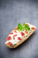 Crispbread with soft cheese with herbs and bacon.