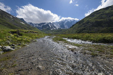 Crystal clear water of river in mountain gorge