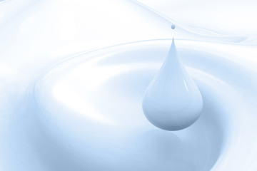 droplet of blue milk on blue background